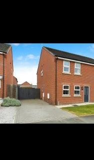 Suburban Semi-Detached Home and Driveway.png