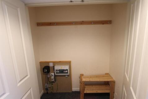 Large double cloak cupboard in hall.JPG