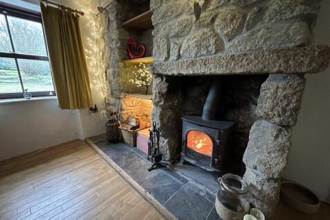 Woodburner in granite fireplace