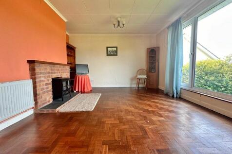 Living room with original woodblock f...