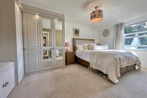 Bedroom with bespoke fitted furniture