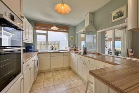 Kitchen with integrated appliances an...