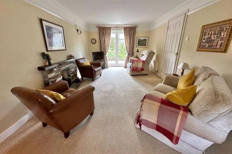 Sitting room with doors to garden and...