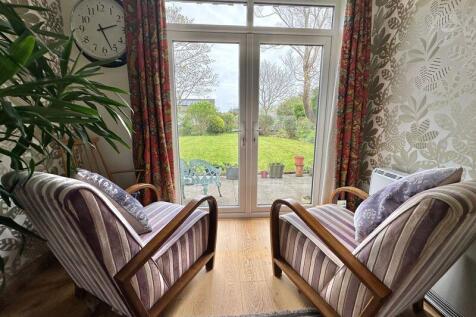 Sitting area with doors to garden
