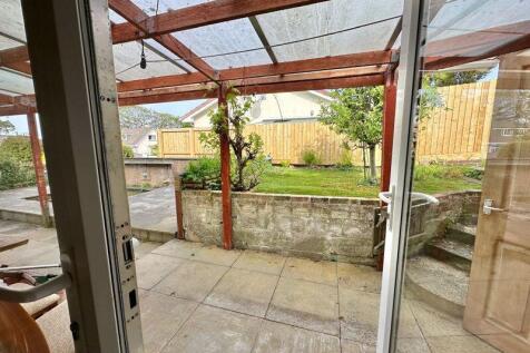 Doors to garden with covered area