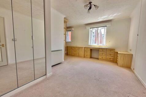 Bedroom with fitted furniture