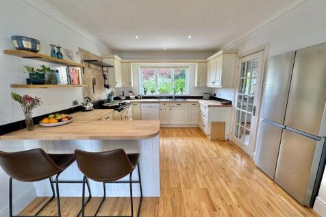 Kitchen with break fast bar and space...