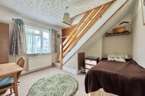 Bedroom With Access To Attic Room