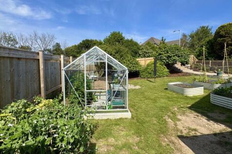 Greenhouse And Vegetable Garden