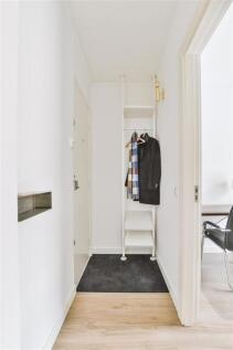 narrow-corridor-with-doors-2025-02-10-11-46-44-utc