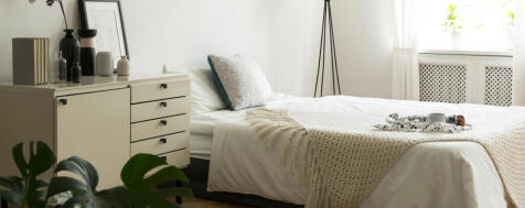 real-photo-of-bedside-table-with-books-poster-and-