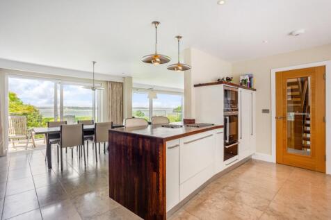 Kitchen and dining area with view and balcony