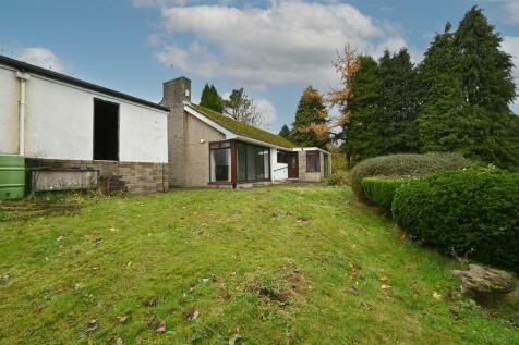 Rear of the home and rear of garage.jpg