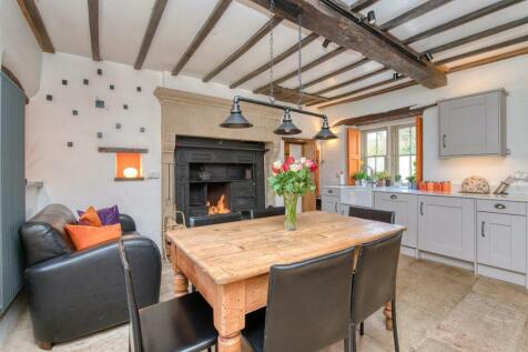 Dining Room - table, stove and shuttered window.jp