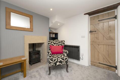 Manor Cottage Bedroom One fireplace.jpg