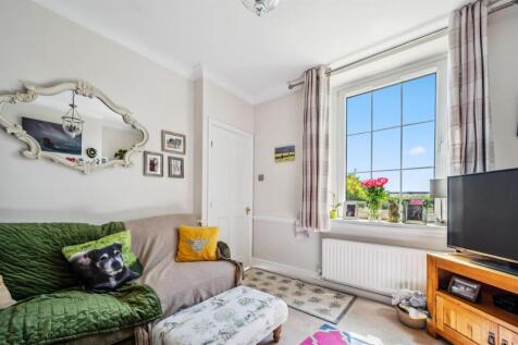 Sitting Room - window and door to entrance porch.j
