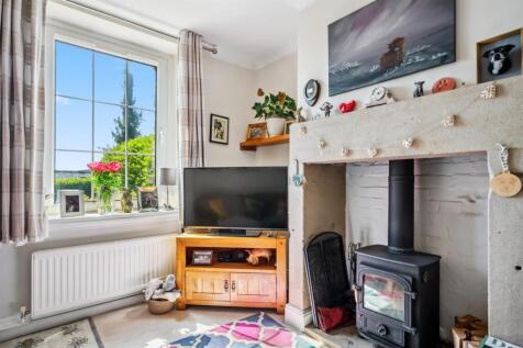 Sitting Room - fireplace and window.jpg
