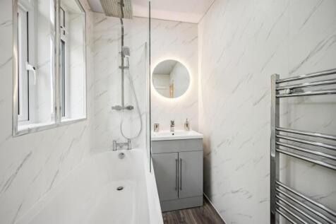 Bathroom - bath, shower and vanity unit.jpg
