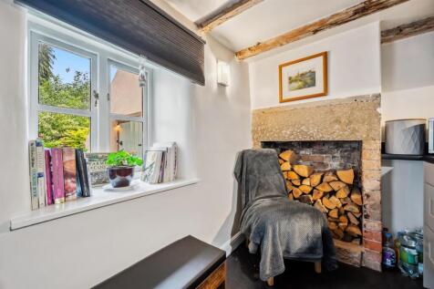 Kitchen - fireplace and window.jpg