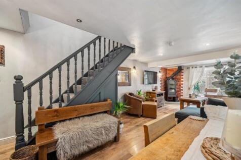 Dining area to stairs and living room.jpg