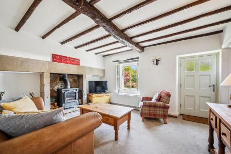 Sitting Room towards fireplace and window.jpg