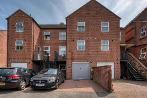 Rear of the home - parking and garage.jpg