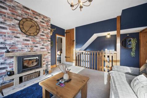 Sitting Room - fireplace and stairs.jpg