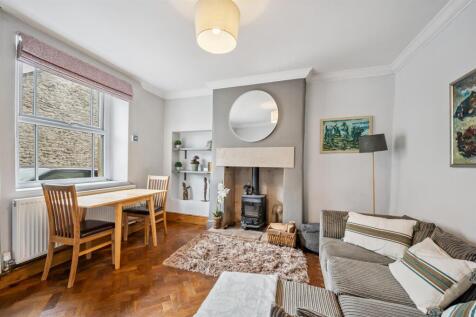 Living Room - dining area, window and fireplace.jp
