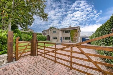Front of the home from driveway gates.jpg