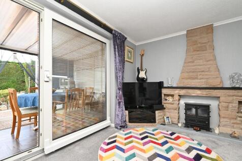 Sitting Room - fireplace and Conservatory.jpg