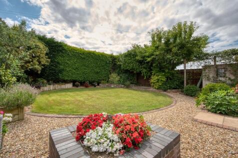 Rear Garden - seating area to lawn.jpg