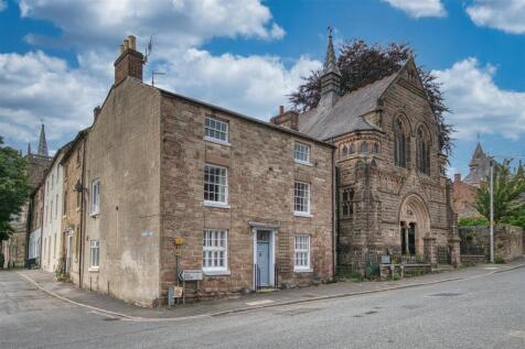 Front of the home and road towards churchyard.jpg