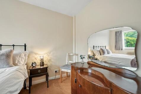Bedroom One - bed and dressing table.jpg