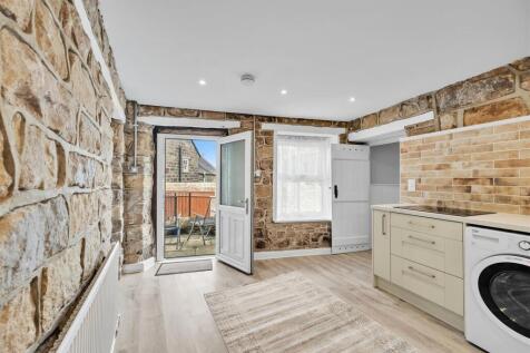 Kitchen 2 to elevated patio.jpg