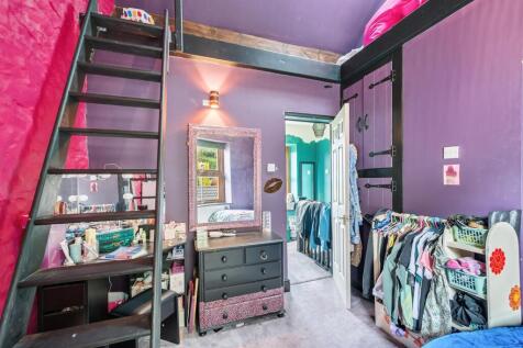 Bedroom and stairs to mezzanine.jpg