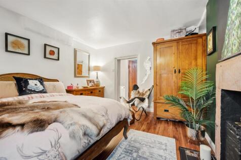 Bedroom - bed and towards bathroom.jpg