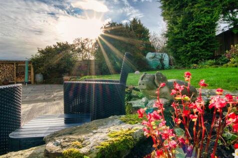 Rear Garden decking and log store.jpg