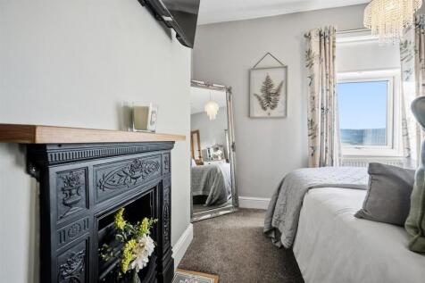 Bedroom Three - fireplace and window.jpg