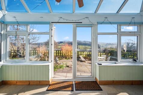 View to garden and countryside from conservatory.j
