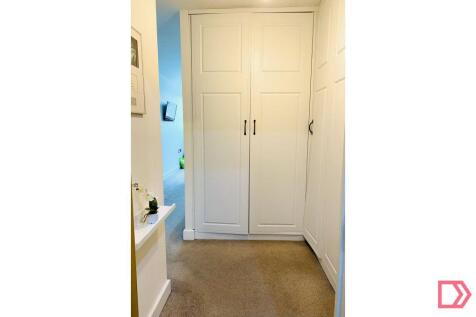Dressing area with fitted wardrobes