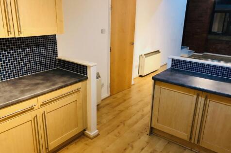 Large Kitchen leading to lounge area