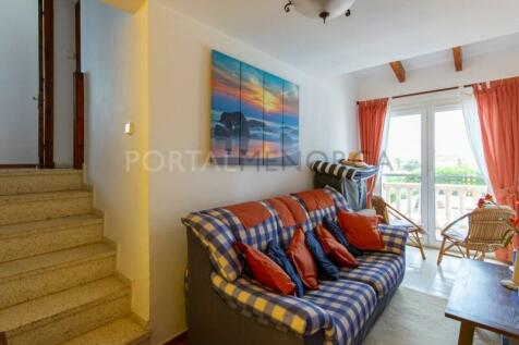 Seating area of villa with sea views and pool in S&#39;Algar