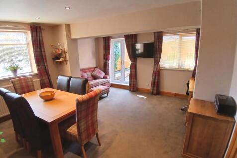 DINING ROOM THROUGH TO GARDEN ROOM