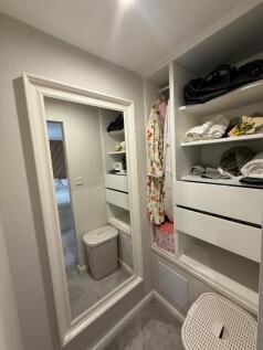 BEDROOM ONE WALK-IN CUPBOARD