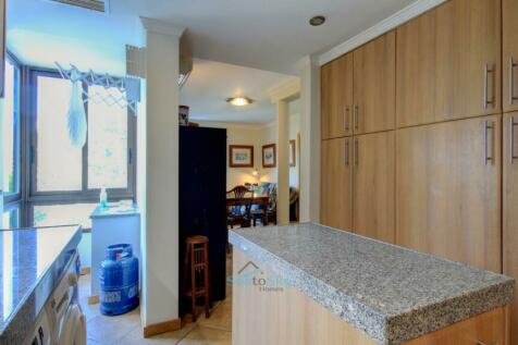 wall of cupboards and integrated appliances