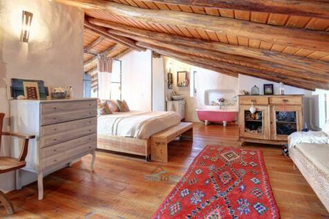 charming wood floored bedroom