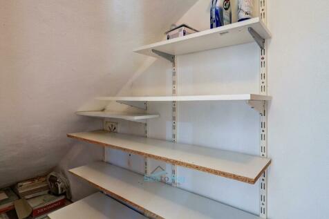 large cupboard under the stairs