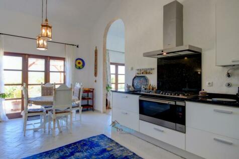 fitted kitchen with large oven and gas hob