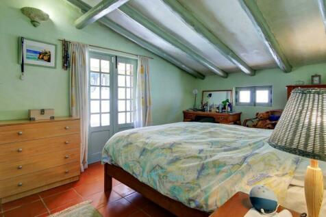 bedroom with patio doors to courtyard