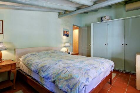 bedroom with built in wardrobes and air-conditioning